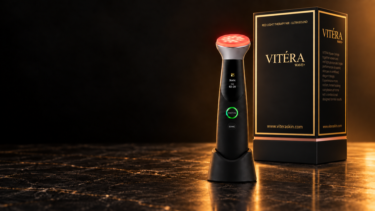 Vitera Wave on its charging stand beside its black and gold box